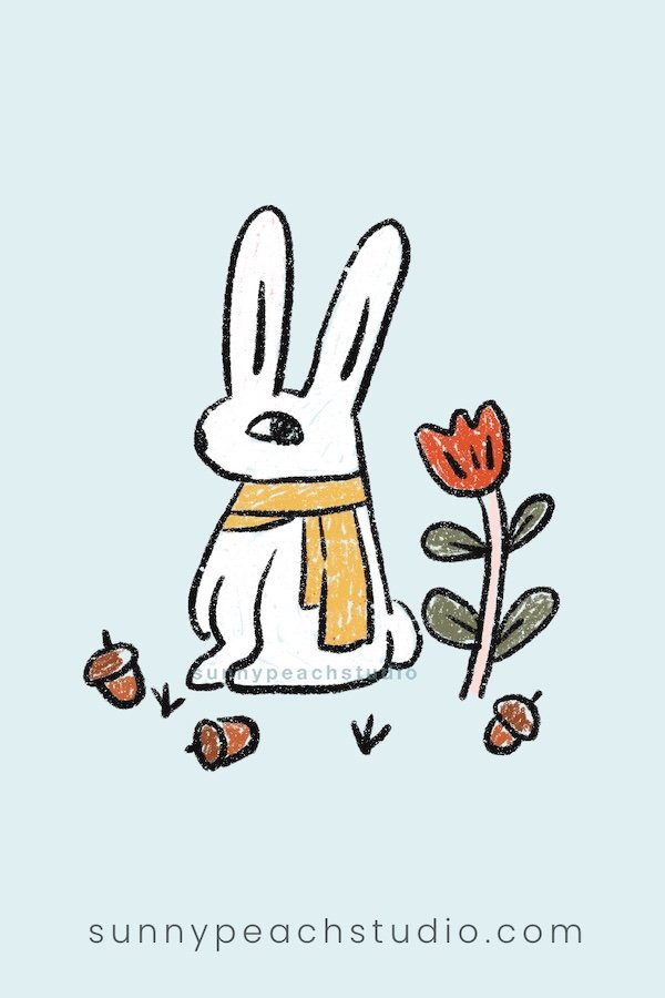 Cute fall bunny wearing a scarf with acorns and a flower