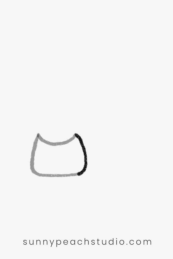Completing the simple cat head shape with pointed ears