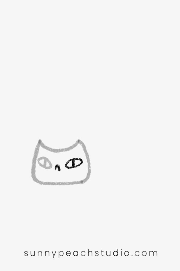 Drawing the cat's eyes and small nose