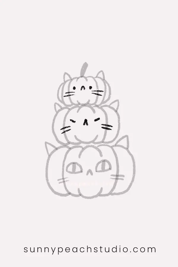Add different cute cat faces to all three pumpkins