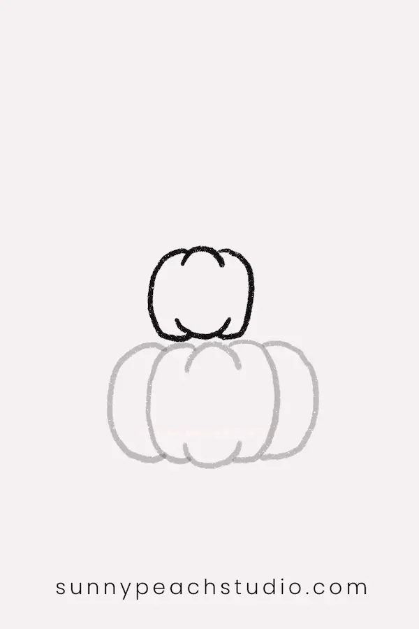 Draw a smaller pumpkin on top of the first pumpkin