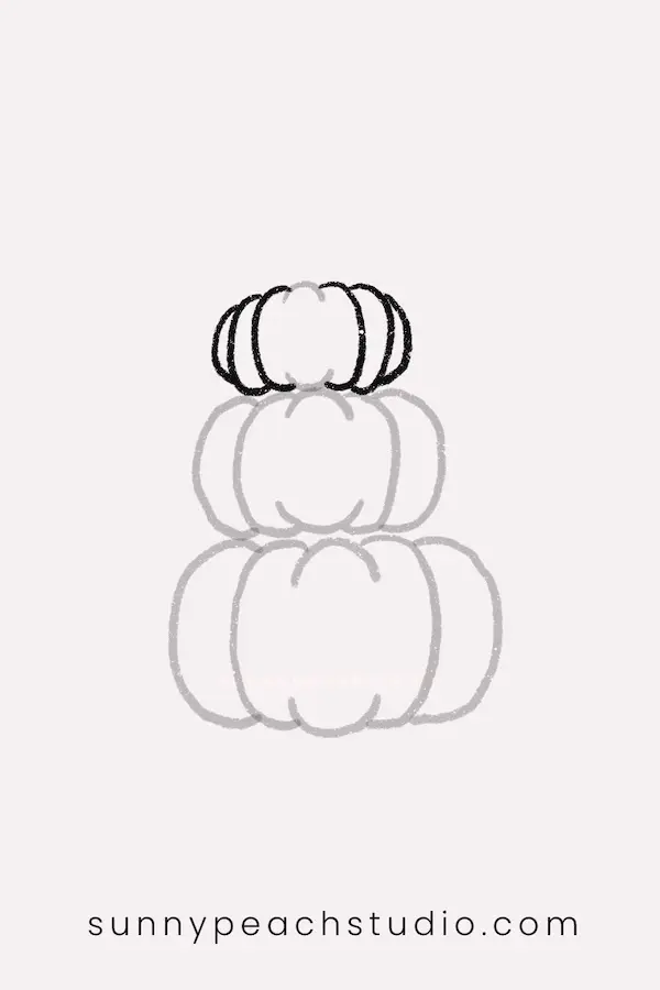 Complete a stack of three simple pumpkins