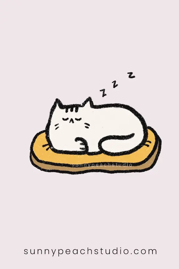 Cute sleepy cat curled up on a yellow cushion